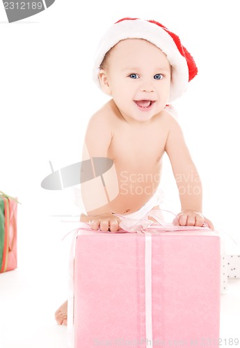 Image of santa helper baby with christmas gifts