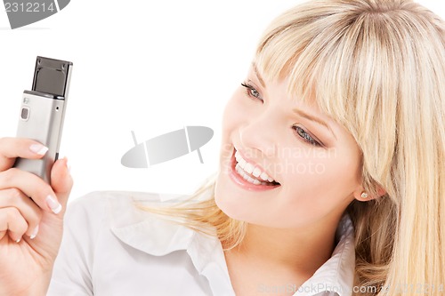 Image of happy woman using phone camera