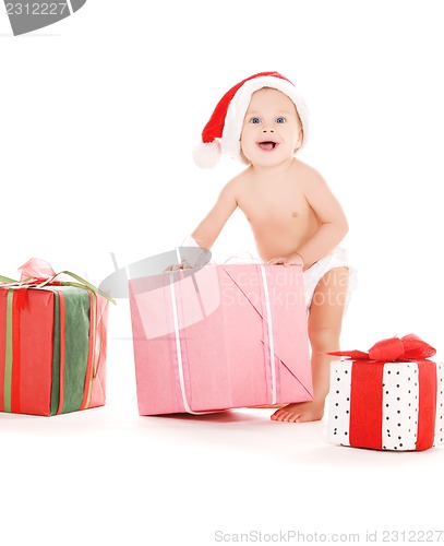 Image of santa helper baby with christmas gifts