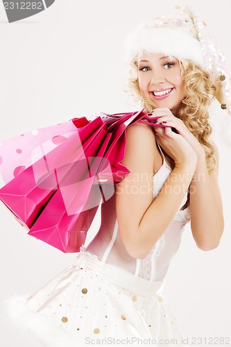 Image of santa helper with pink shopping bags