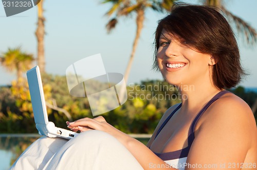 Image of lovely woman with laptop computer