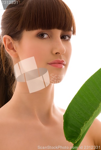 Image of woman with green leaf