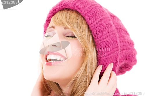 Image of happy teenage girl in hat