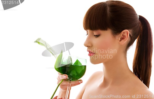 Image of woman with green leaf and glass of water