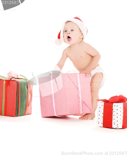 Image of santa helper baby with christmas gifts