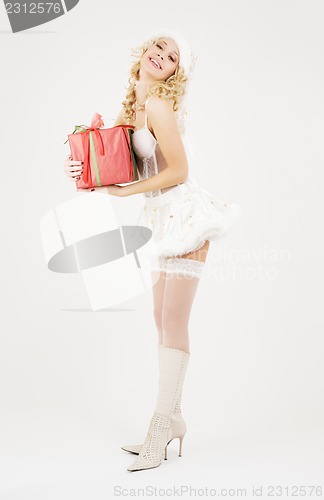 Image of cheerful santa helper girl with gift box