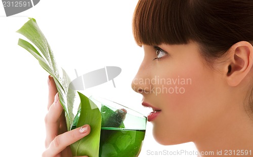 Image of woman with green leaf and glass of water