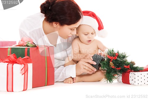 Image of baby and mother with christmas gifts