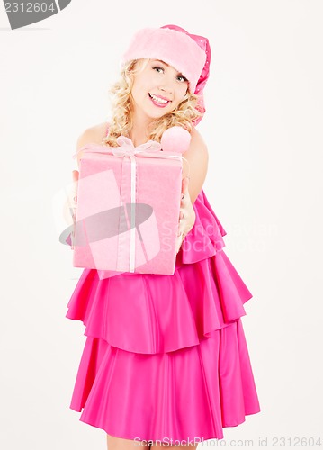 Image of cheerful santa helper girl with gift box