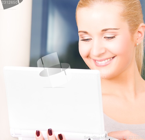 Image of happy businesswoman with laptop computer