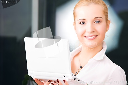 Image of happy businesswoman with laptop computer