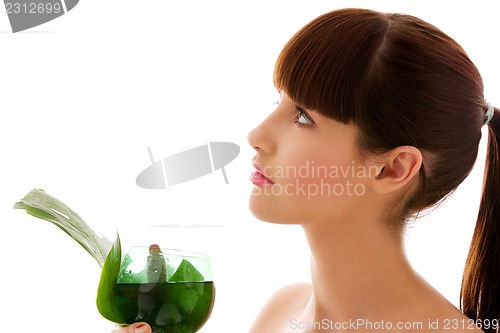 Image of woman with green leaf and glass of water