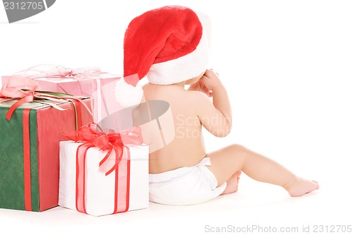 Image of santa helper baby with christmas gifts