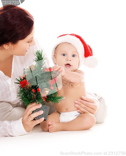 Image of baby and mother with christmas gifts
