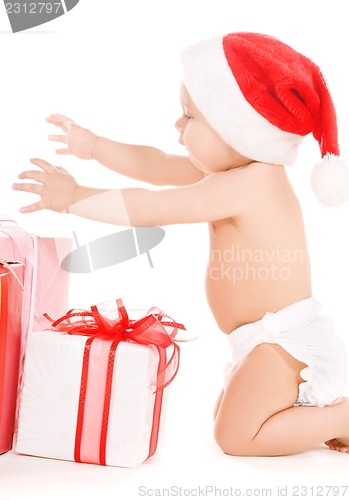 Image of santa helper baby with christmas gifts