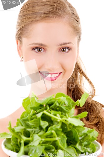 Image of happy woman with spinach