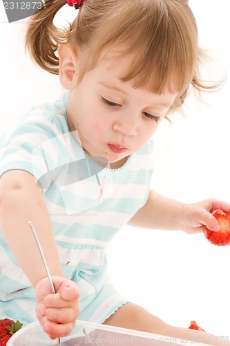 Image of little girl with strawberry