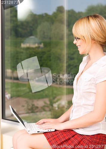 Image of office girl with laptop computer