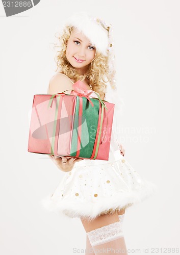 Image of cheerful santa helper girl with gift box