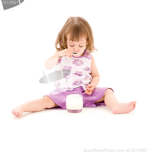 Image of little girl with yogurt