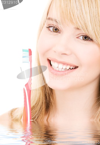 Image of happy girl with toothbrush