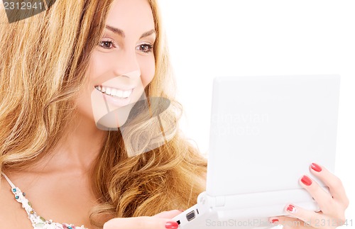Image of happy woman with laptop computer