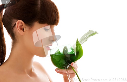 Image of woman with green leaf and glass of water