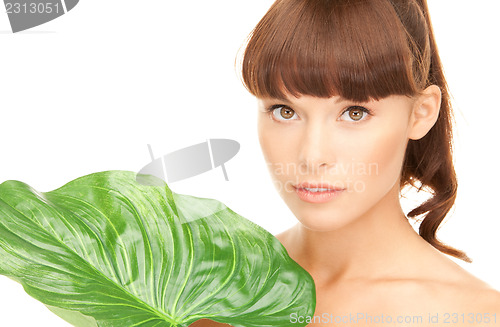 Image of woman with green leaf