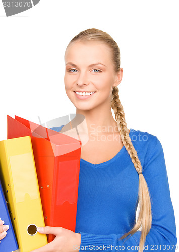 Image of young attractive businesswoman with folders