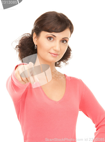 Image of attractive businesswoman pointing her finger