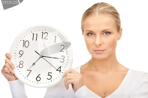 Image of woman holding big clock