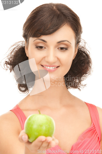 Image of young beautiful woman with green apple