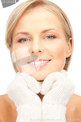 Image of beautiful woman in white mittens 