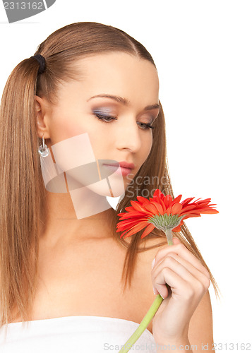 Image of woman in towel with red flower