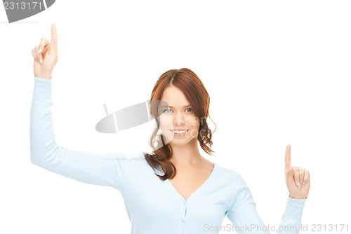Image of businesswoman working with something imaginary