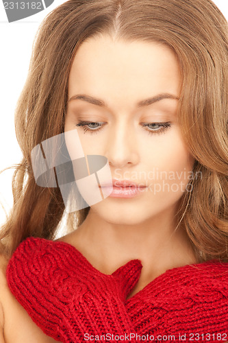 Image of beautiful woman in red mittens 