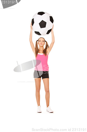 Image of lovely woman with big soccer ball