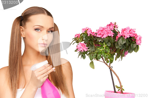 Image of lovely housewife with flowers