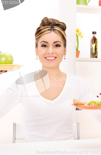 Image of woman with green apple and sandwich