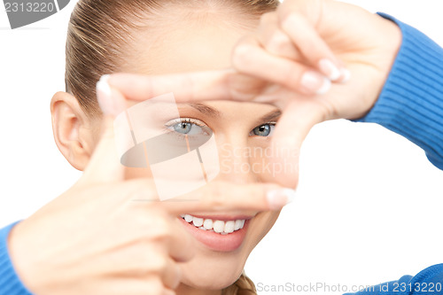 Image of lovely woman creating a frame with fingers