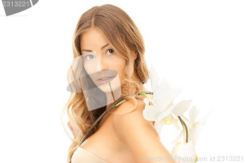 Image of beautiful woman with white flower