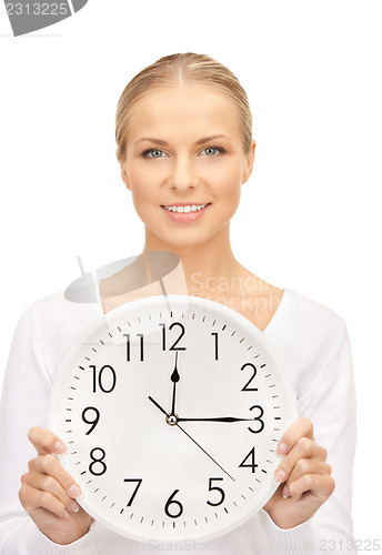 Image of woman holding big clock