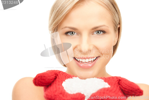 Image of beautiful woman in red mittens with snow