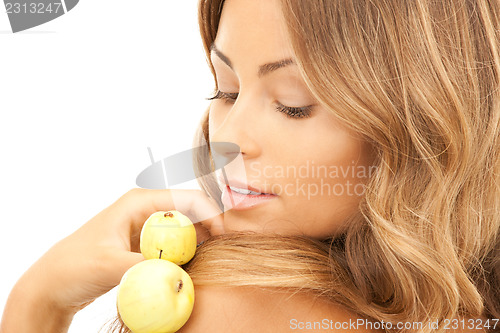 Image of lovely woman with green apples