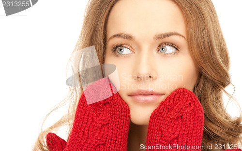 Image of beautiful woman in red mittens 