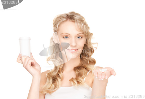 Image of young woman with pills