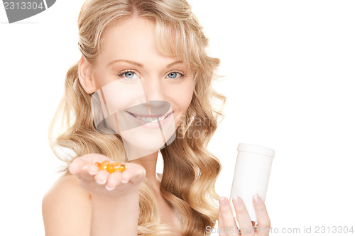 Image of young woman with pills