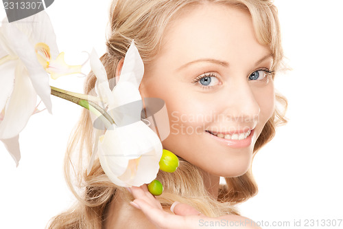 Image of beautiful woman with white flower