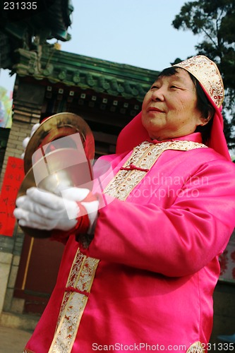 Image of Chinese New Year celebrations in Qingdao, China - performer at a