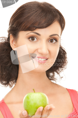 Image of young beautiful woman with green apple